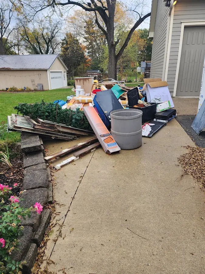Dumpster being loaded with debris for Commercial Dumpster Rental in Fullerton